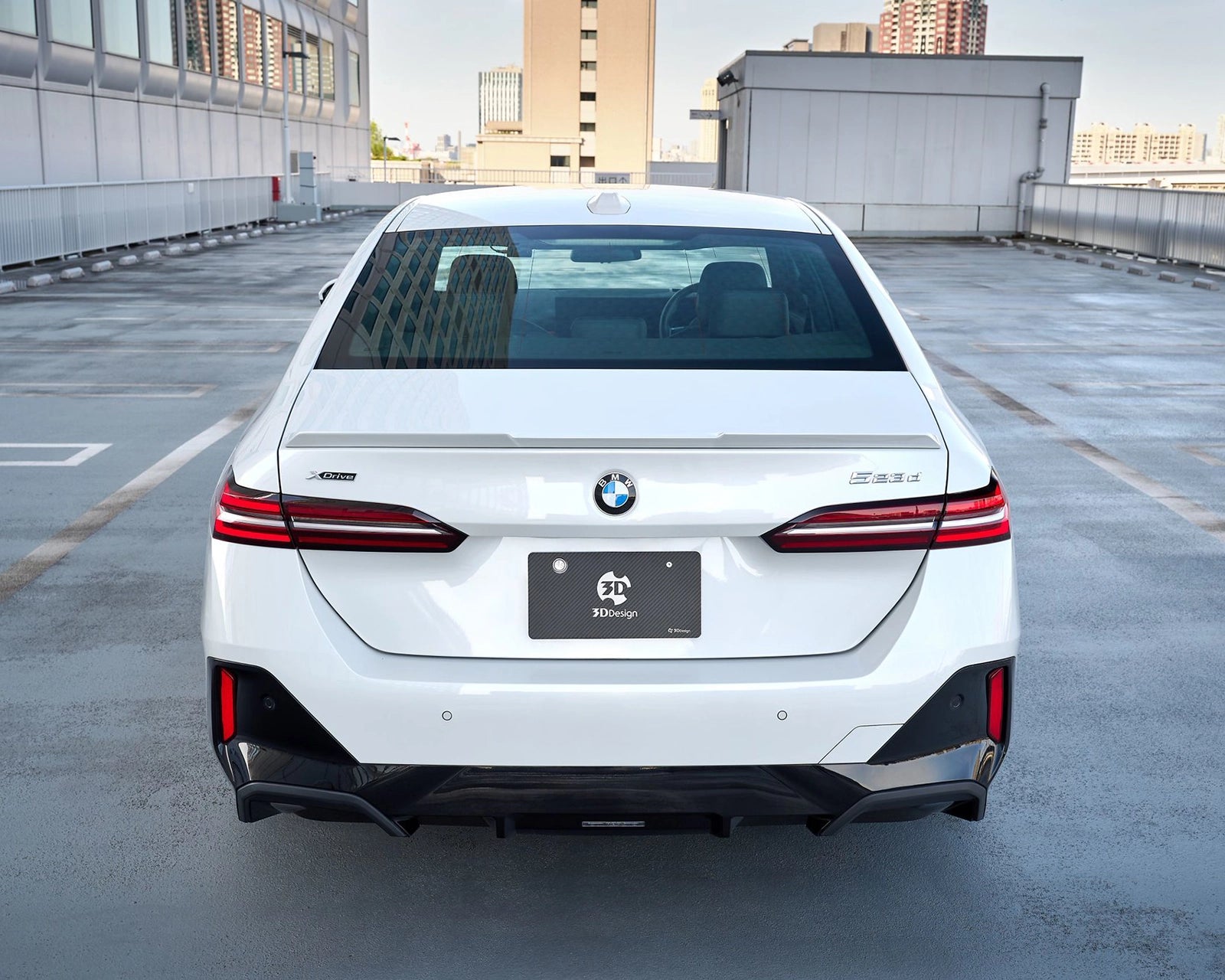 Rear view of a white BMW G60 fitted with the 3DDesign GFRP trunk spoiler