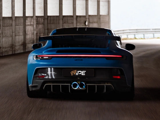 Blue sports car with a visible brand logo in an outdoor setting