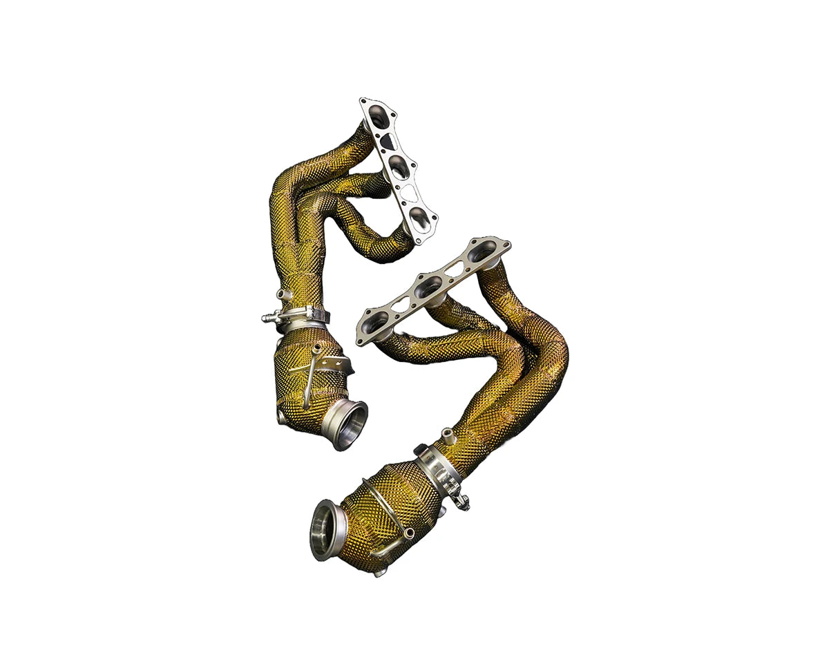 Porsche 992 GT3 RS headers completely covered in golden heatshield.