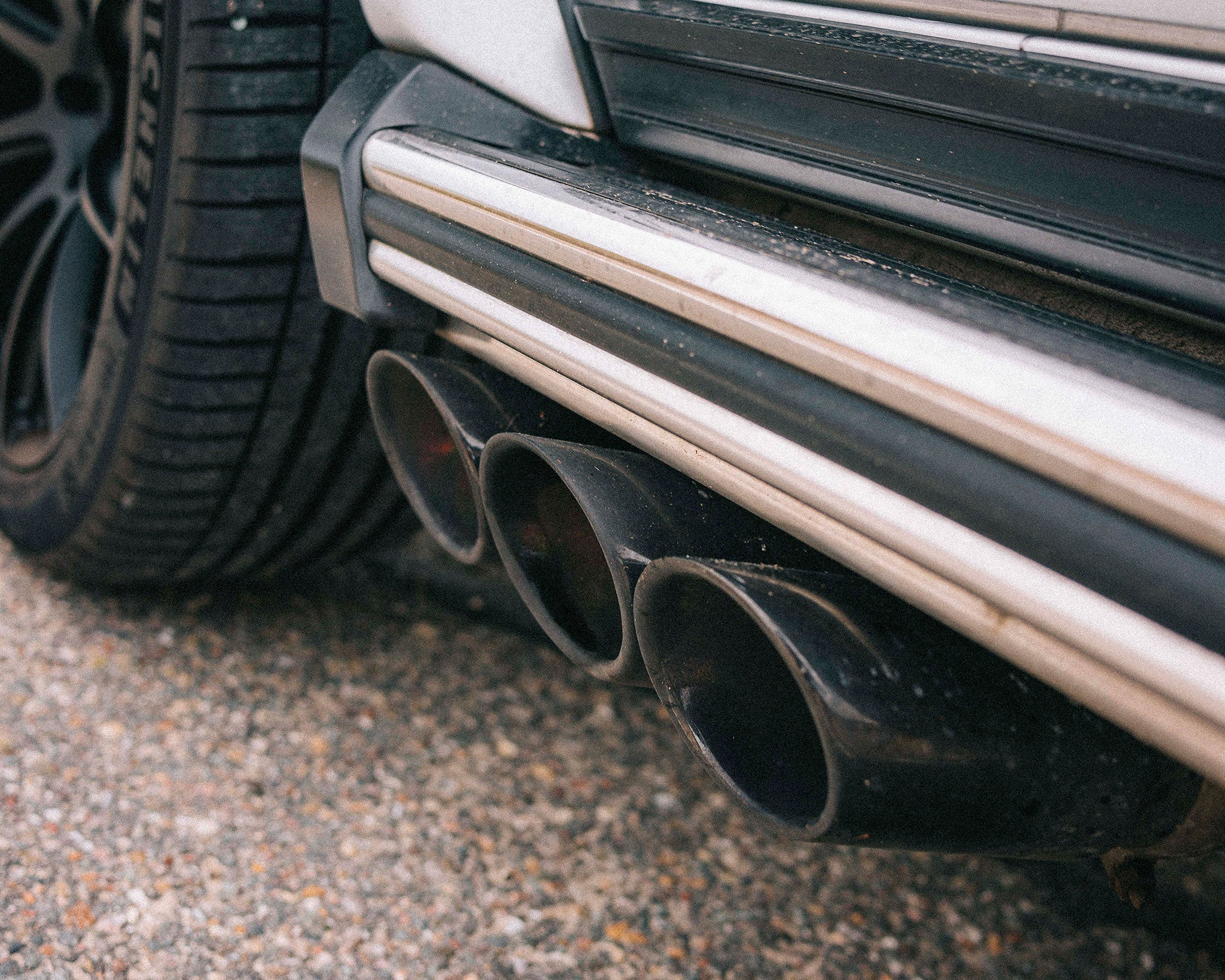 IPE black chrome tailpipes installed on a Mercedes G63 AMG W463