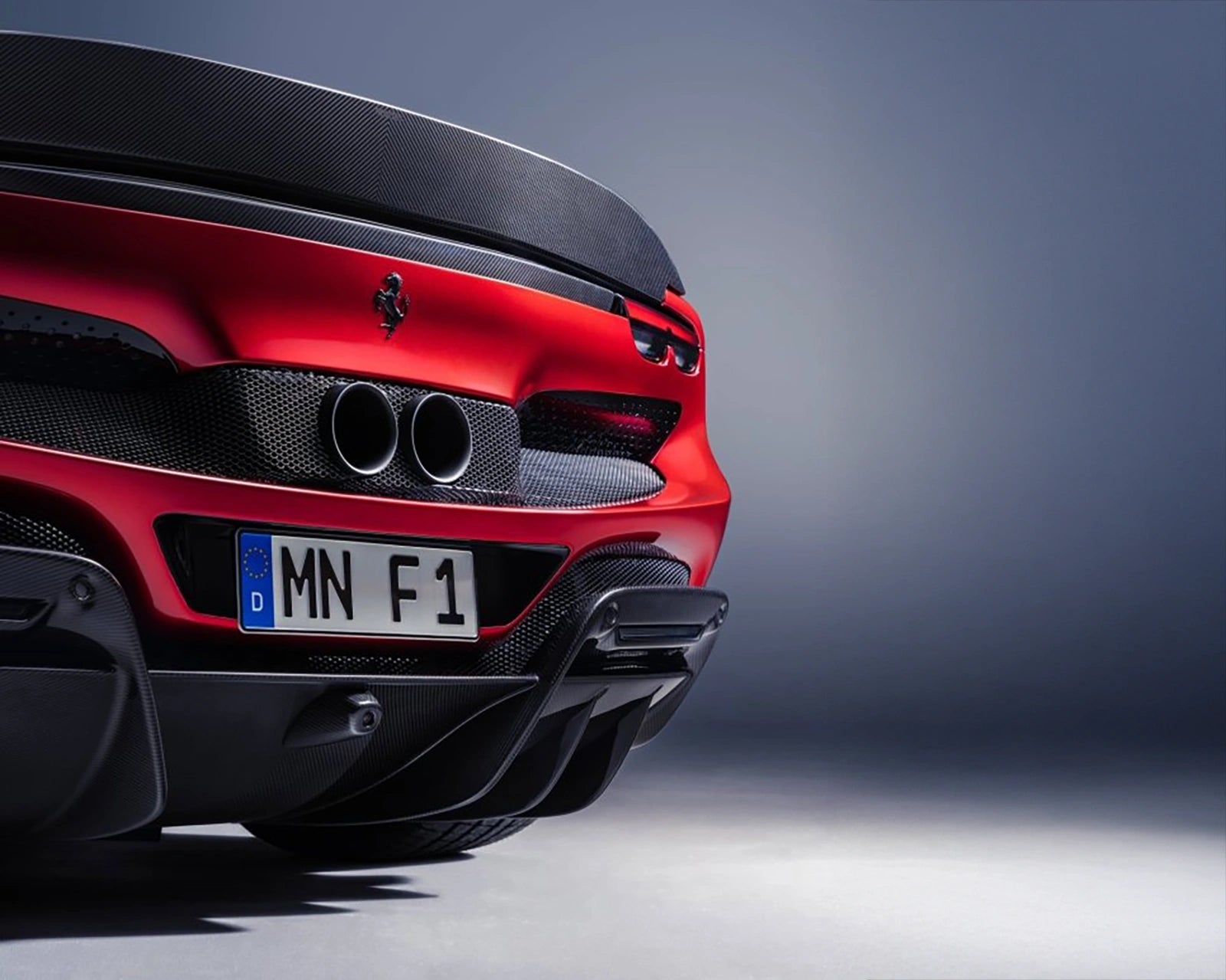 Ferrari 296 GTS rear view with roof open and diffuser visible