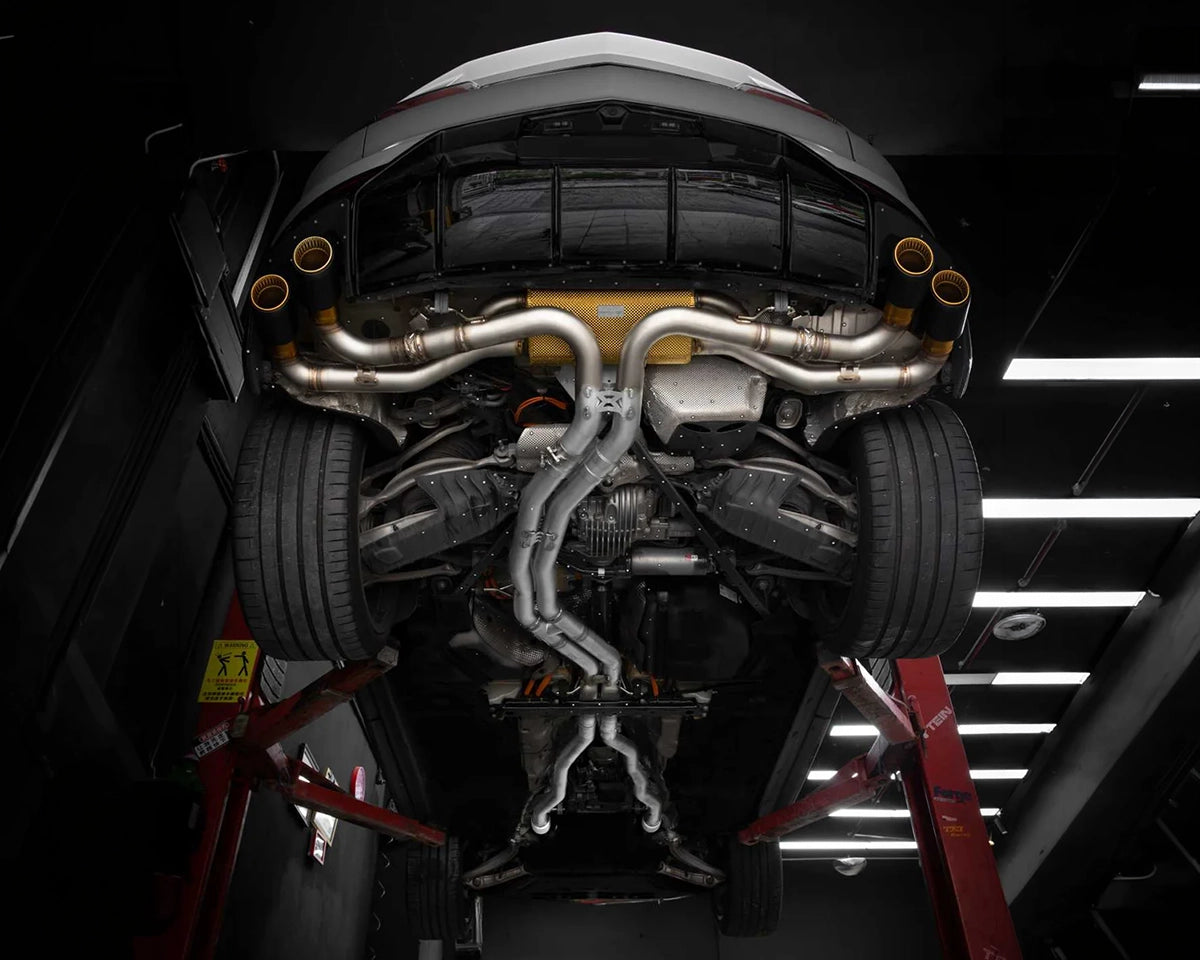 Lamborghini Urus SE with an installed iPE Valvetronic exhaust and black exhaust tips with gold accents
