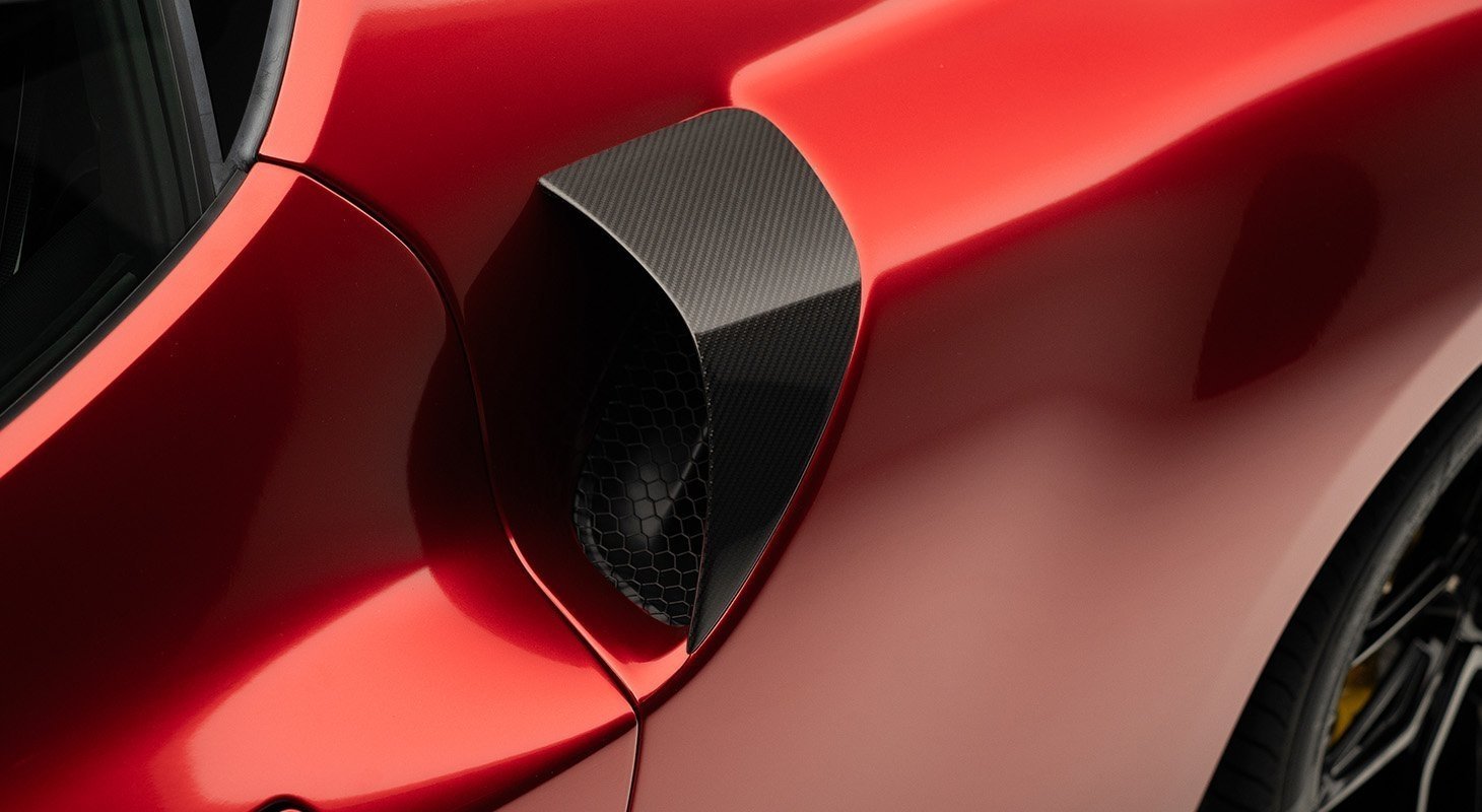 Novitec carbon air intake inserts on Ferrari 296 GTB side
