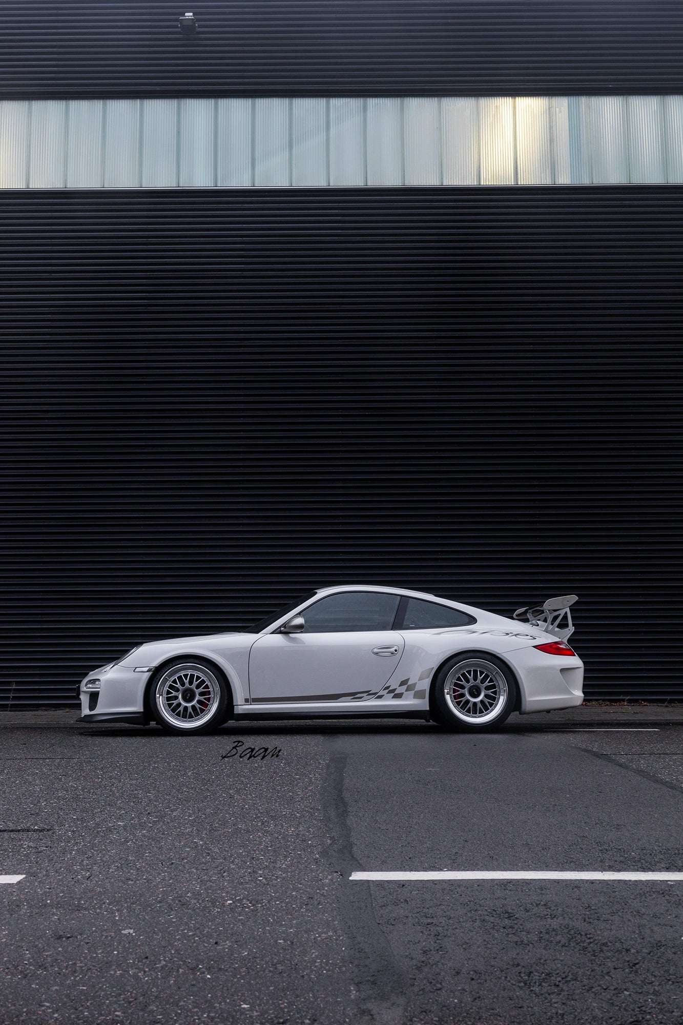 Detail of polished lip and BBS Motorsport bolts on E88 forged wheels mounted on Porsche 997.2 GT3 RS.