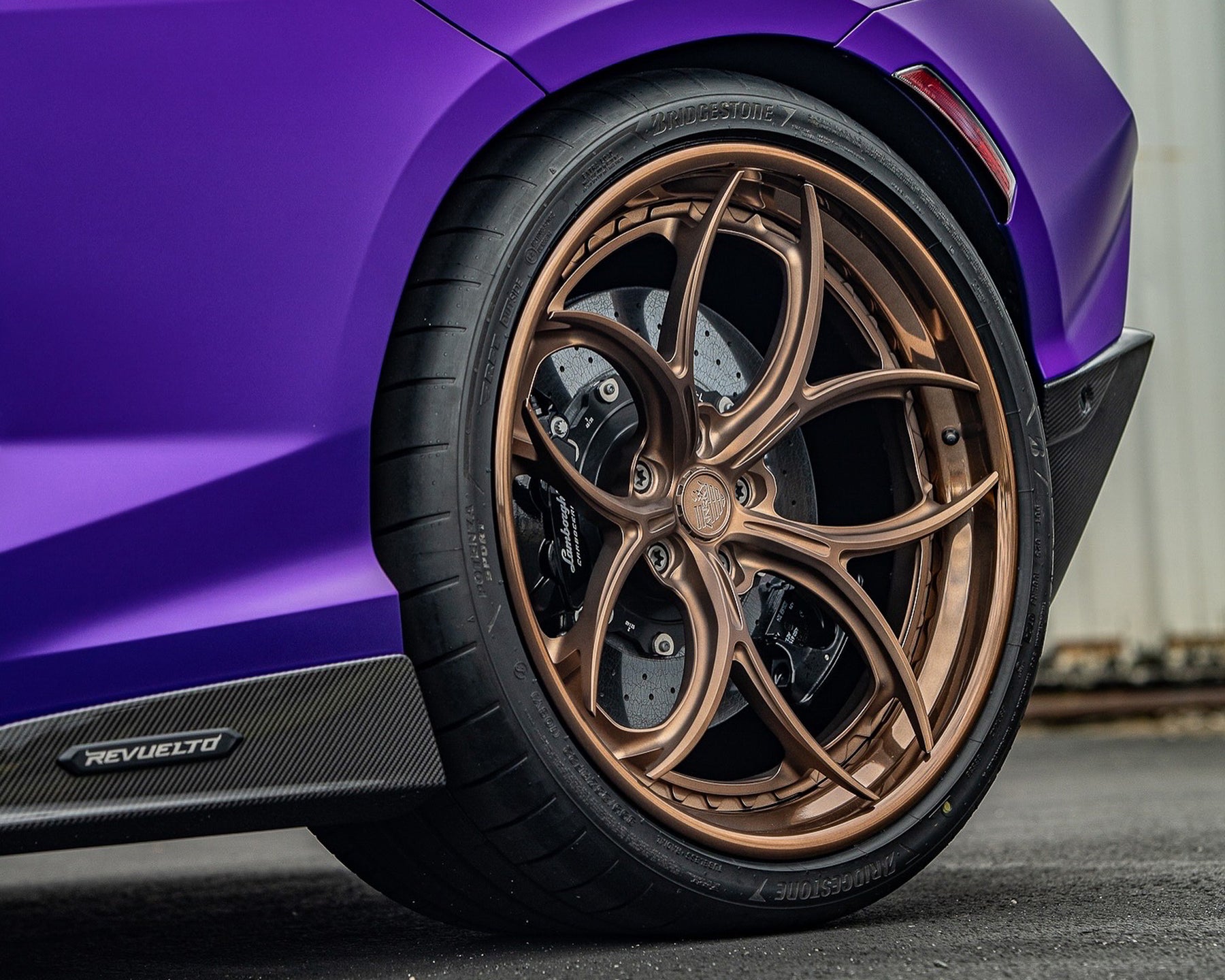 purple Lamborghini revuelto bronze wheels OEM bridgestone tires